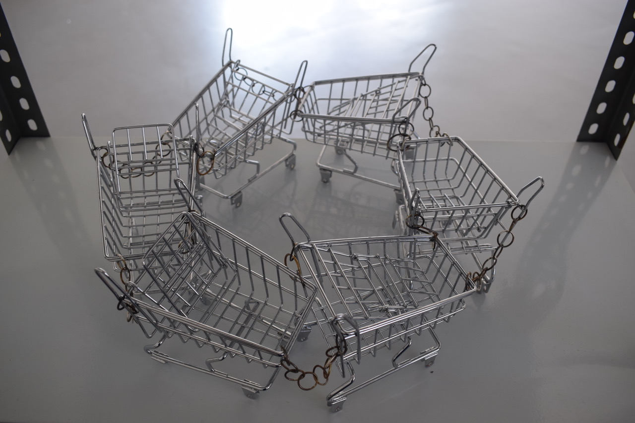 six shopping carts intertwined in a circle