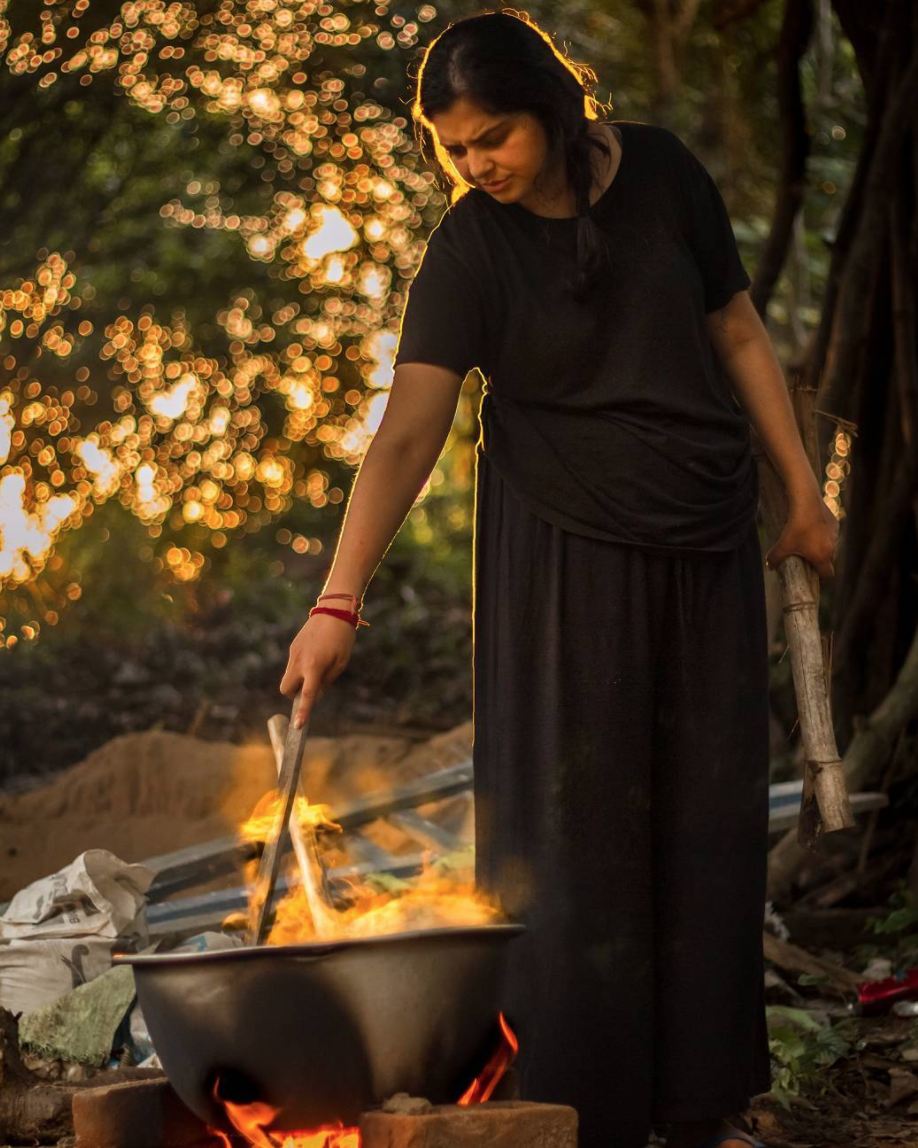 Woman lighting fire
