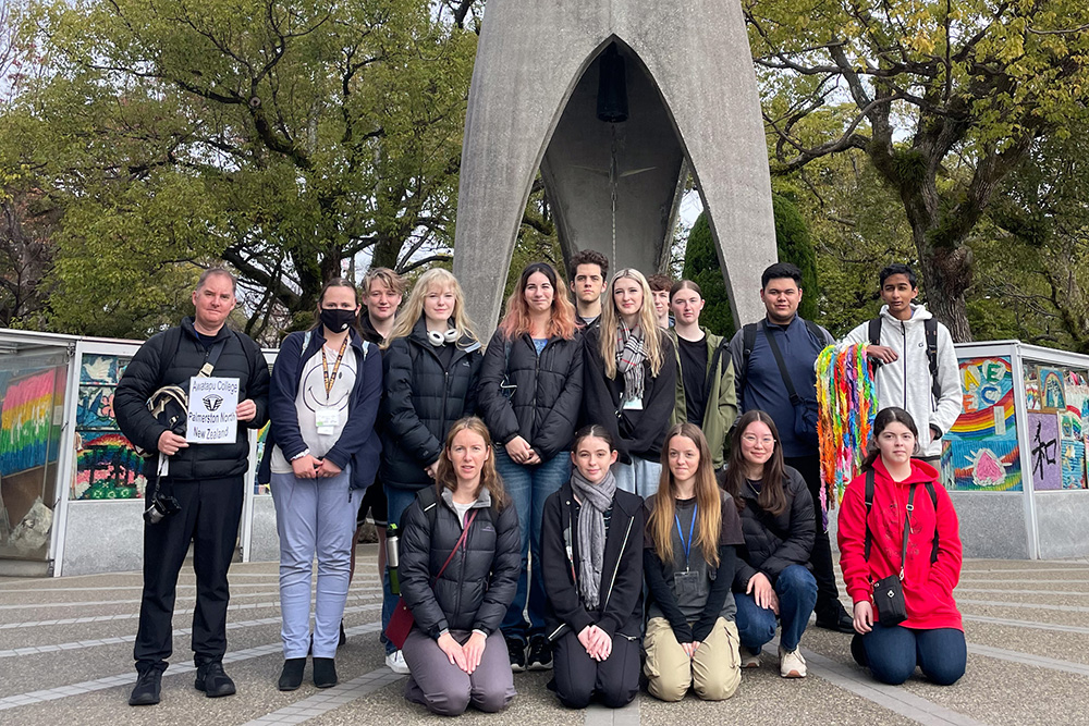 The students and teacher in front of the Childrens Peace Monument in Hiroshima