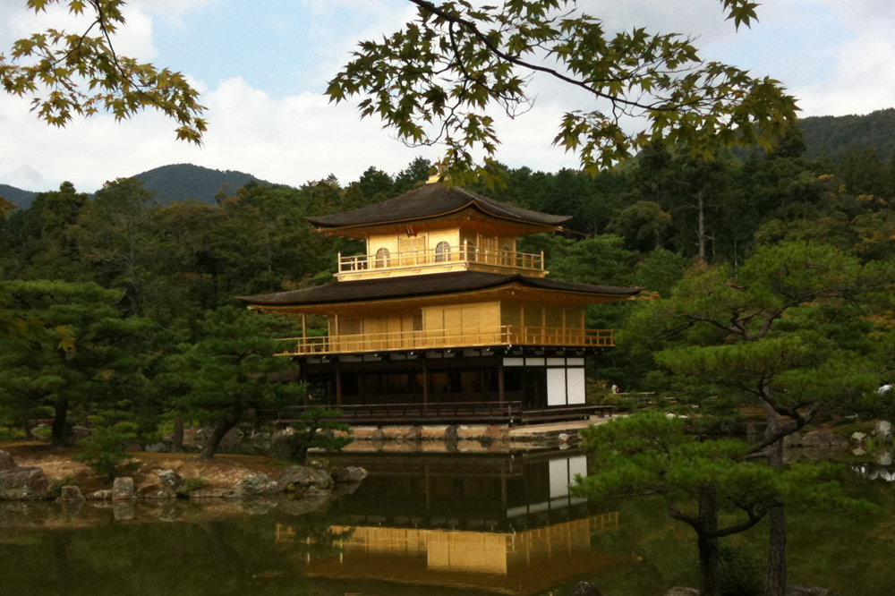 Japanese pavilion on the water in golden colours