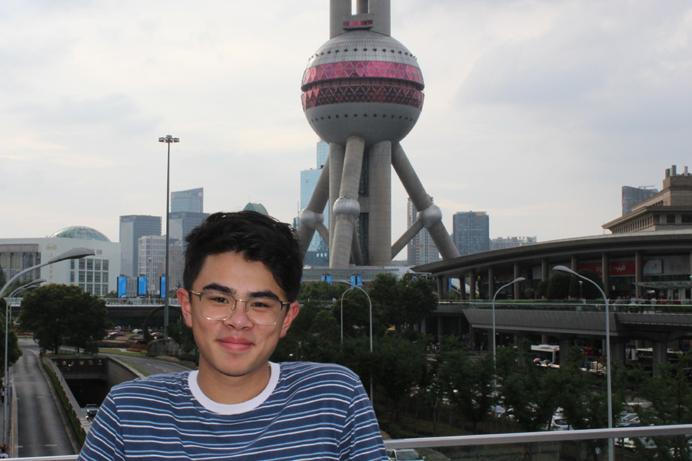 Kevin standing in front of the Pearl Tower in Shanghai