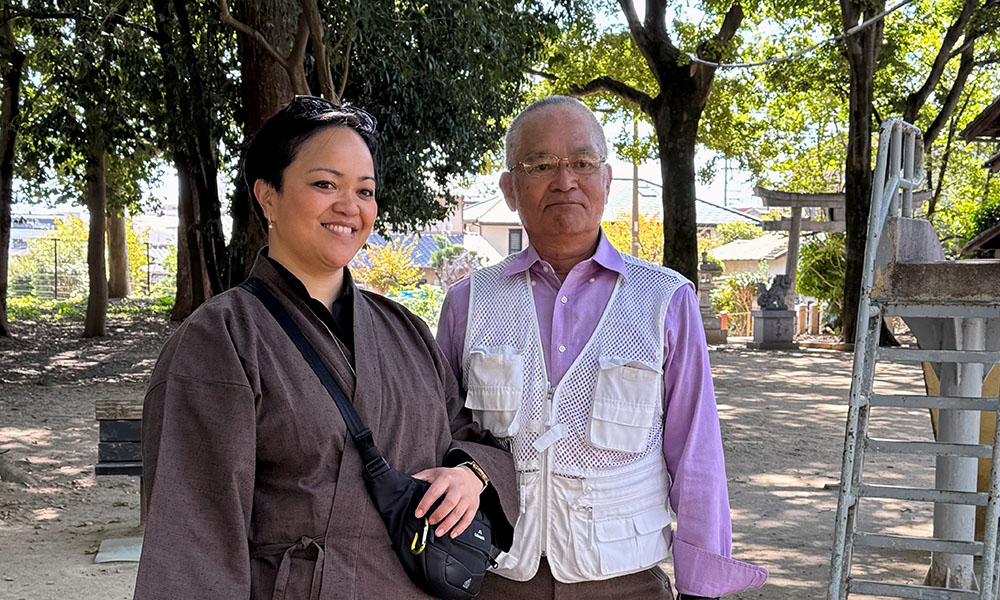 Migoto Eria  standing in a park with her father, Osamu Nakamoto