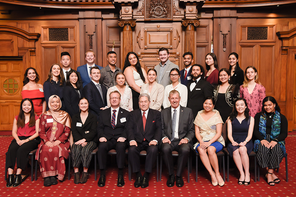 A group photo in Parliaments old debating chamber of the 25 to Watch recipients, Winston Peters, Simon Draper and John Luxton