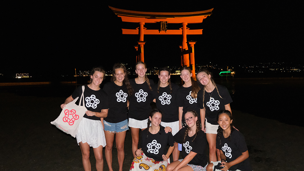 The girls in their Asia New Zealand Foundation t-shirts in front of Itsukushima Floating Tori Gate on Miyajima Island