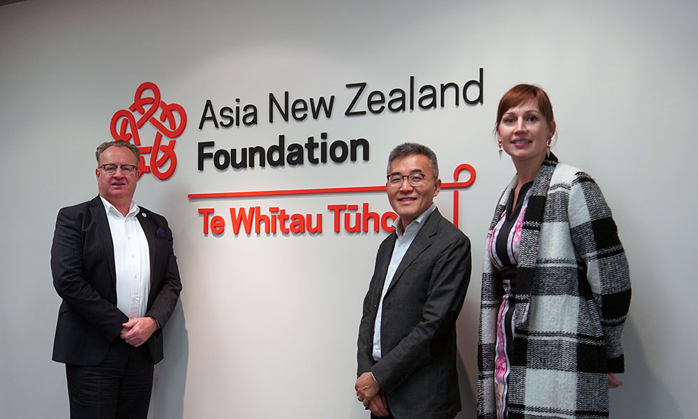 Andrew Tan standing with the Foundation's executive director Simon Draper and director research and engagement Suzannah Jessep