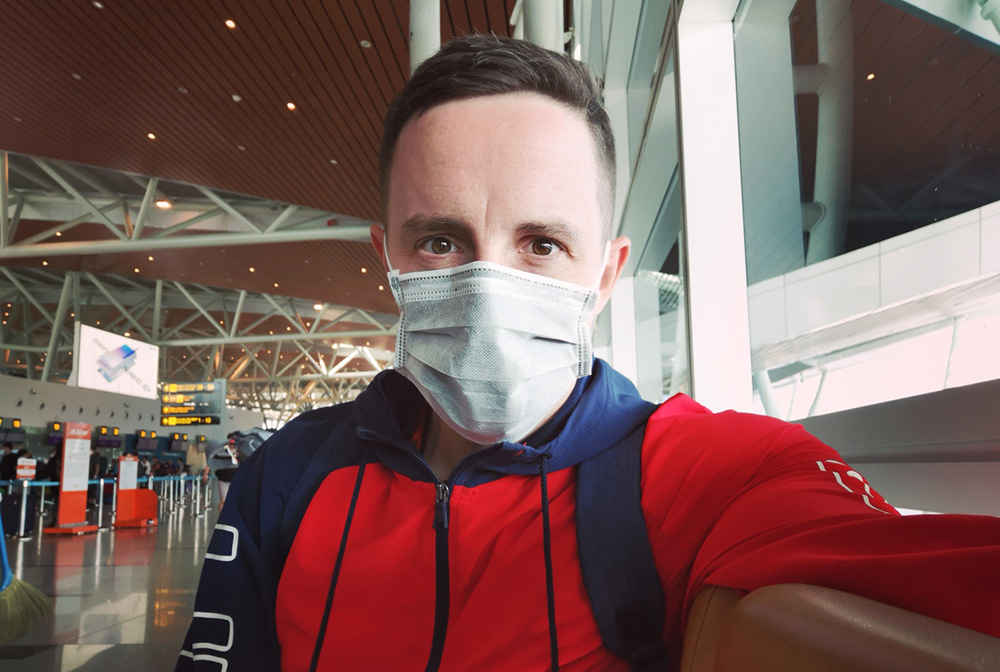 Leadership Network member Ben O'Brien wearing a face mask in an airport terminal