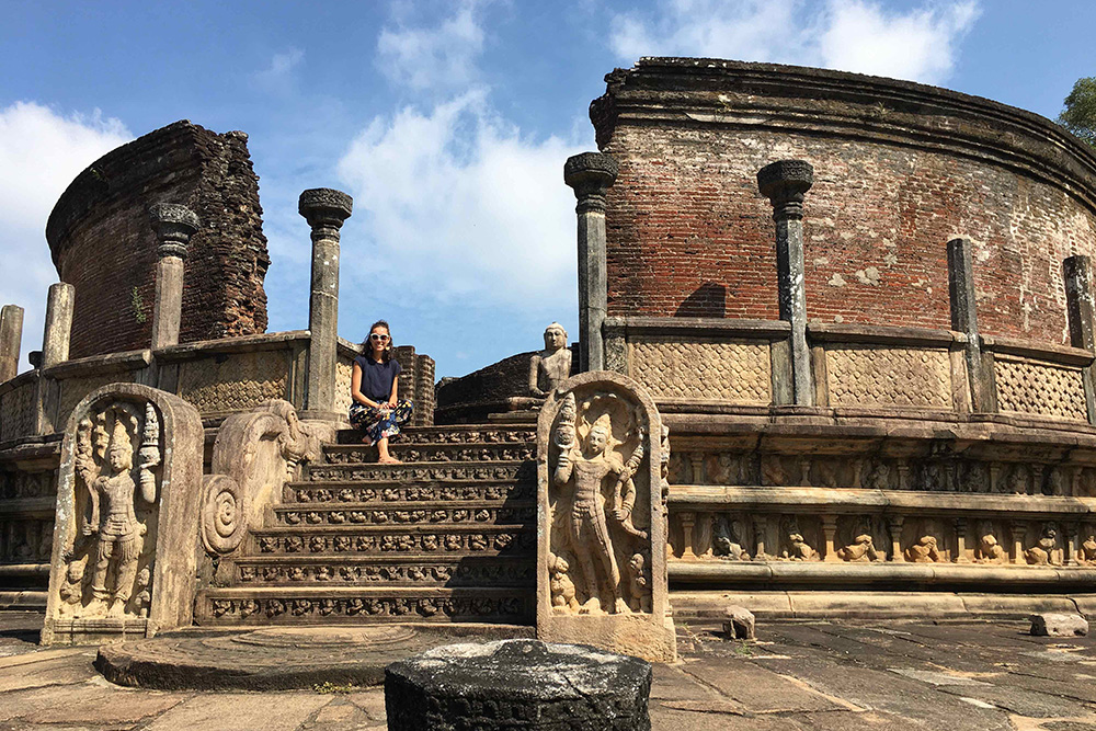 Latu sitting on steps at Polonnaruwa Ancient City, Sri Lanka