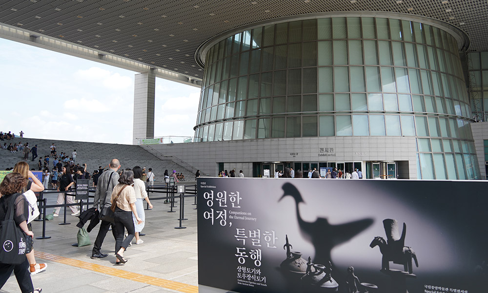 The curators walking into the National Gallery in Seoul