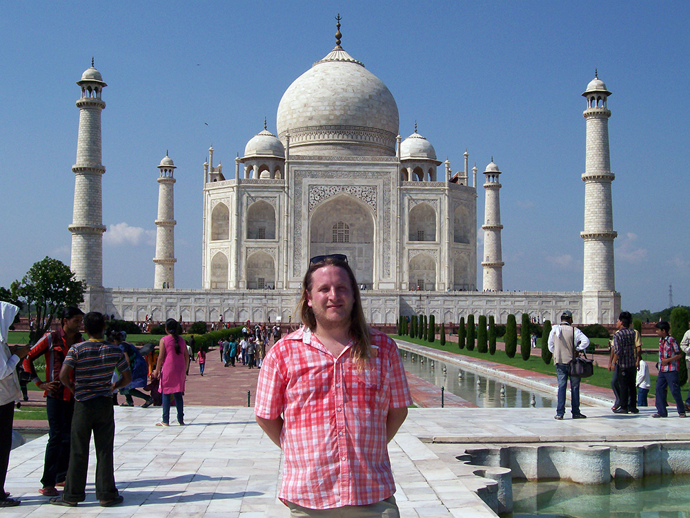 Doc Drumheller standing in front of the Taj Mahal