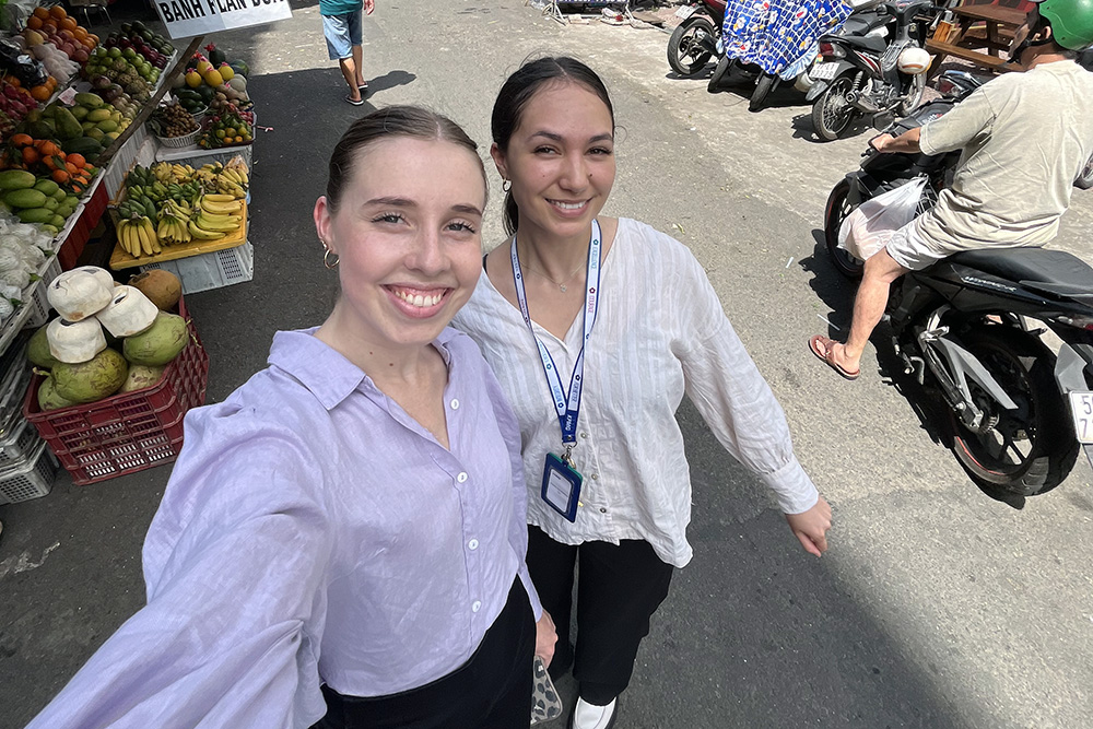 Harriet takes a selfie of herself and fellow intern Cassidy on a street