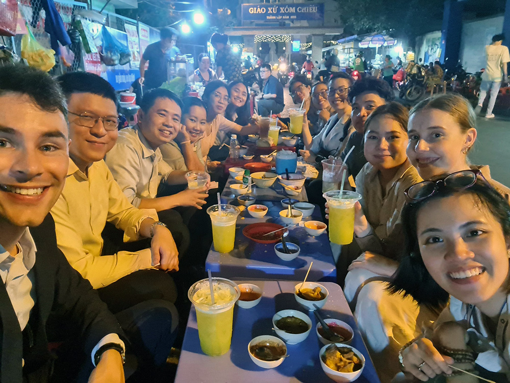 The whole SSG team eating at an outdoor restaurant