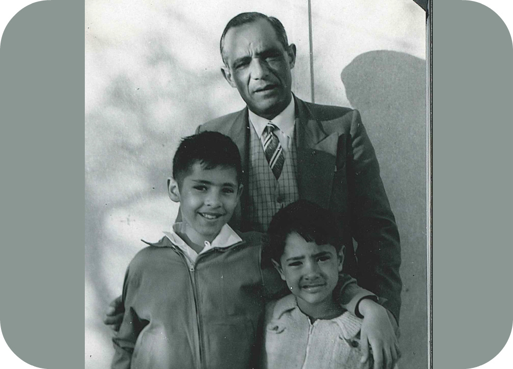 Black and white old photo of man with kids