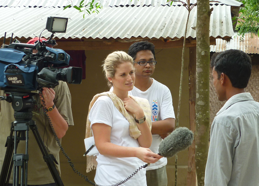 Journalist talking to people in bangladesh