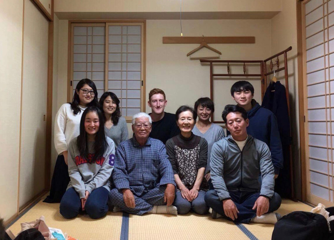 Tom with a Japanese family