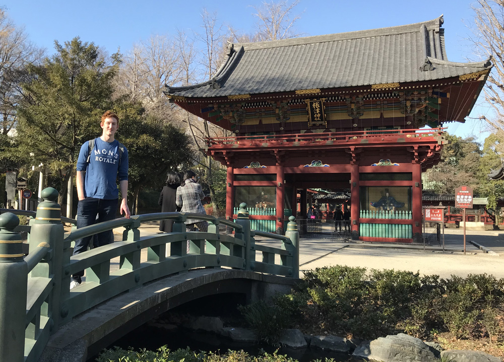 Tom standing in front of Japanese building