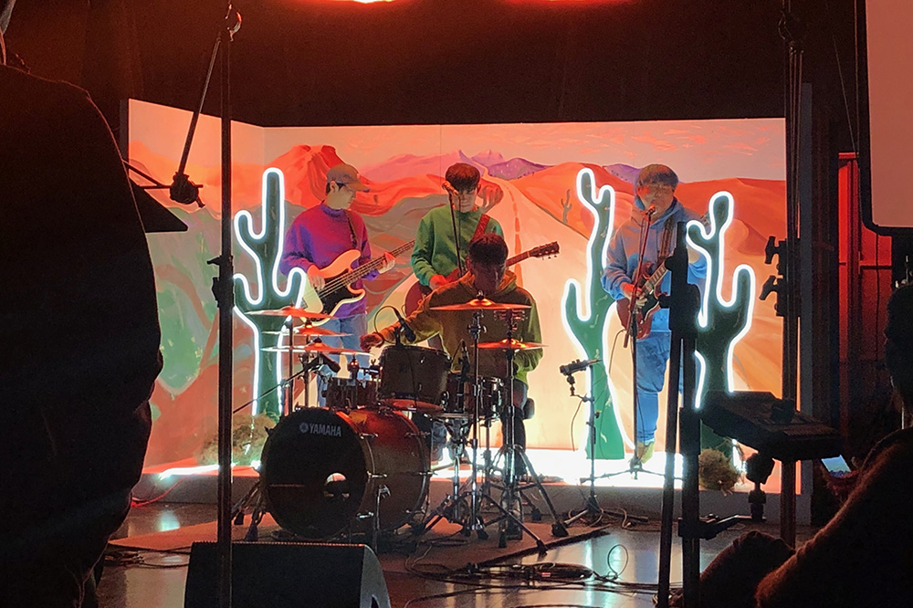 A band playing on a set