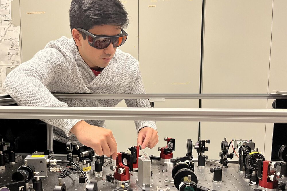 Mikhael working on a configuration of lasers