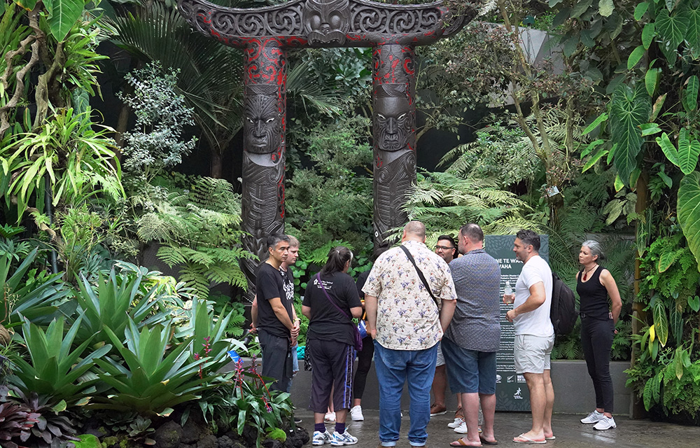 The delegation standing under the  kūwaha (Maori Gate) at Singapore's Marina Bay Gardens