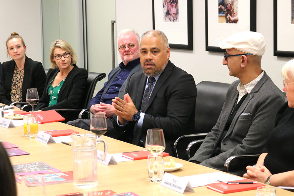 Minister of Defence Peeni Henare addressing a roundtable at the Wellington office