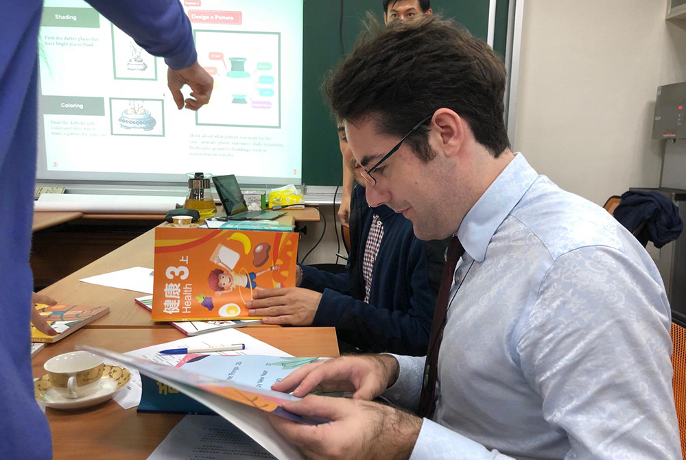 Nathan checking a bilingual textbook before its launch