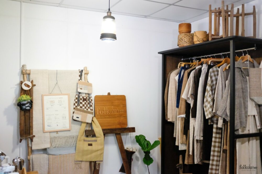 The inside of a Folkcharm store showing garments and accessories