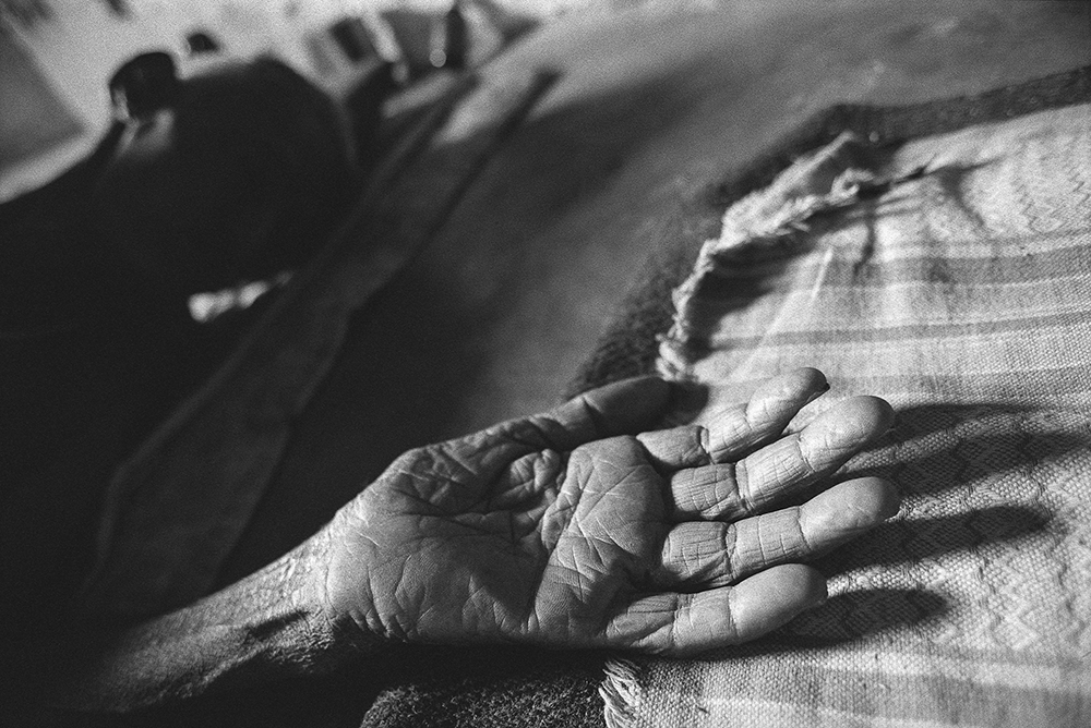 An elderly person's hand