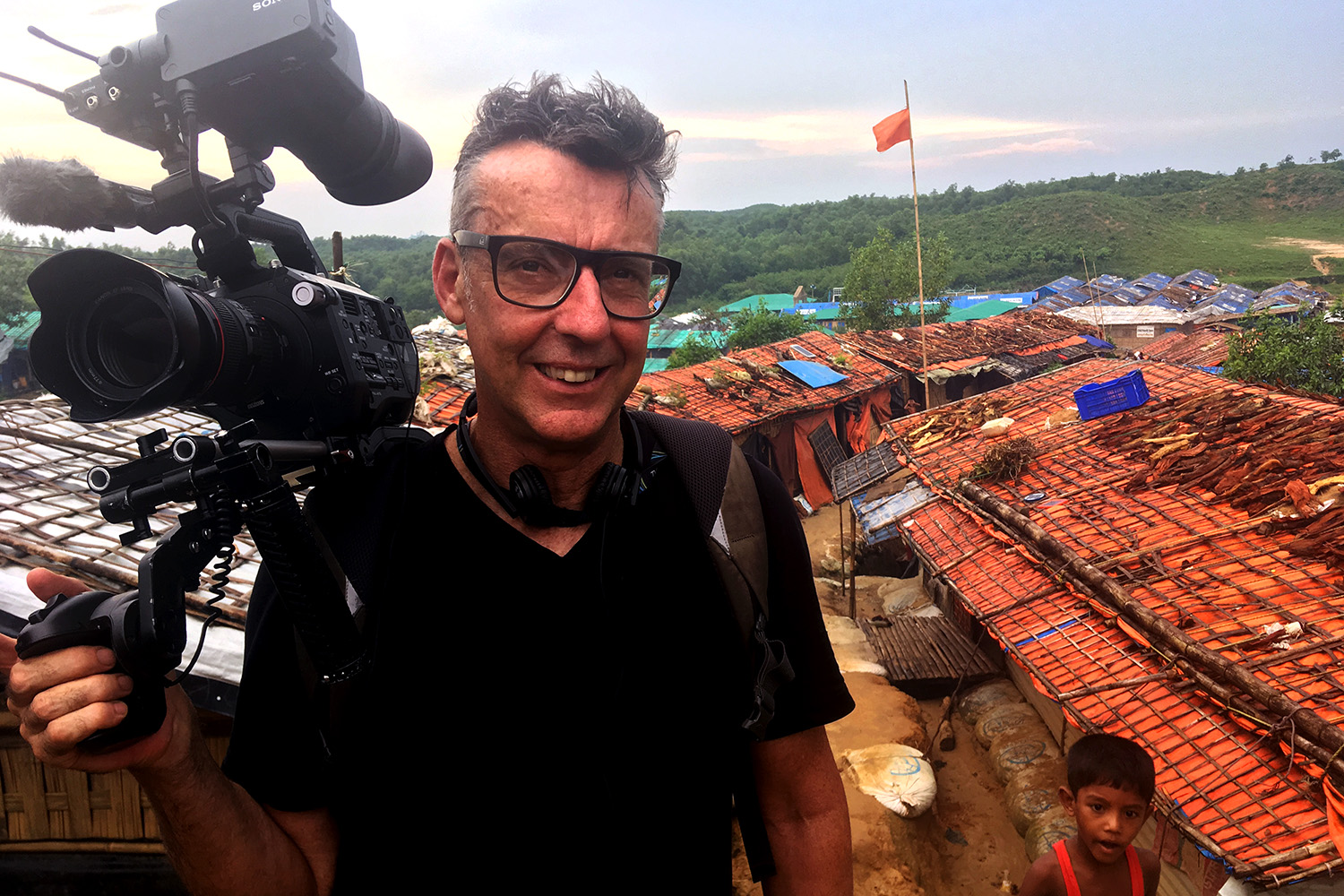 A cameraman standing in village