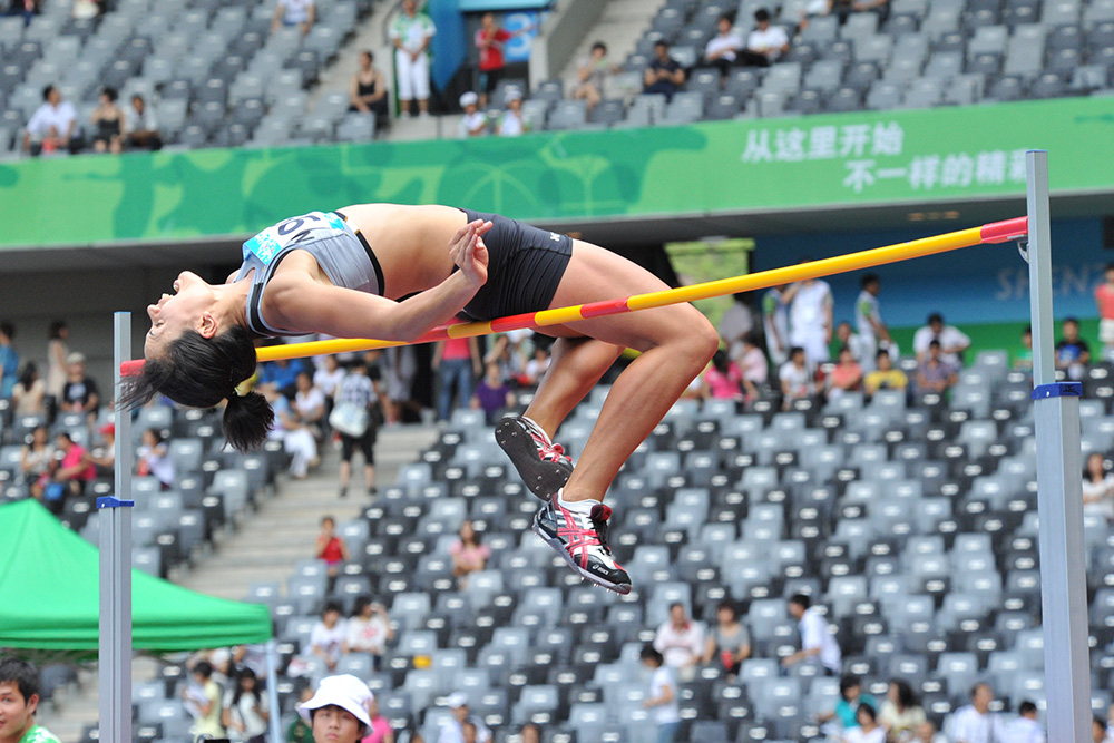 A woman clearing the bar on a high jump