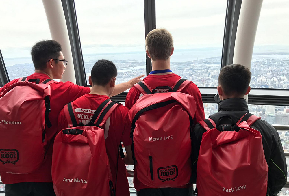 Four of the team looking across Tokyo from the Tokyo Skytree