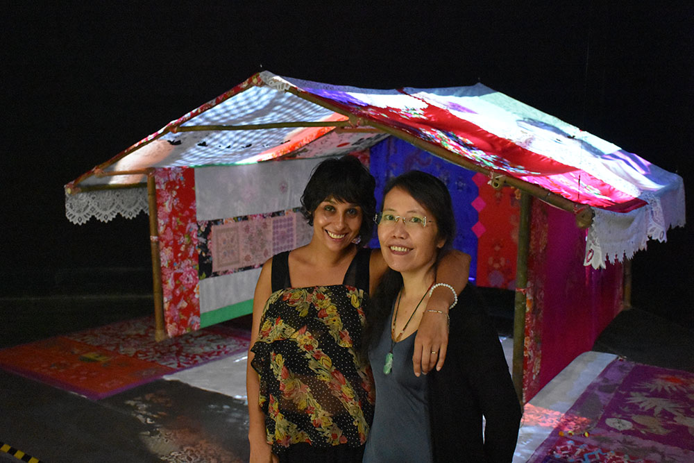 Tiffany Singh and Jui-PIn Chang standing in front of one of Tiffany's artworks