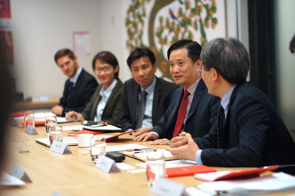 Member of the Track II Vietnam delegation sitting at a board table