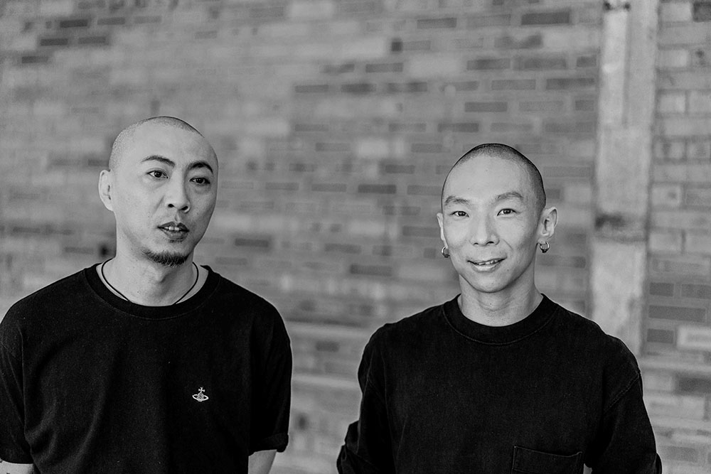 A portrait photograph of choreographers Xin Ji and Xiao Chao