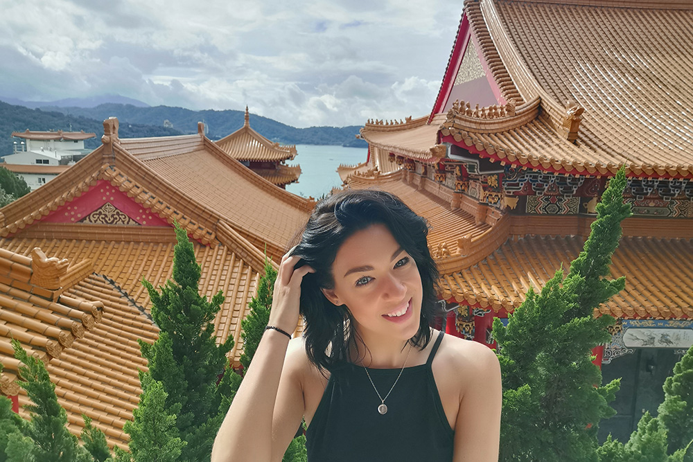 Amanda Cundy with traditional Chinese building behind her
